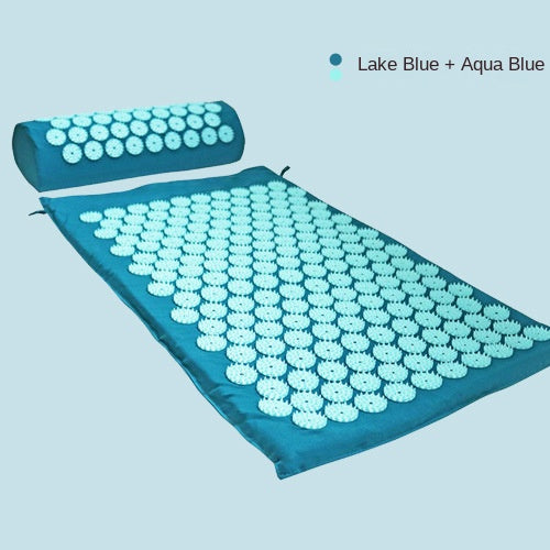 Close-up of textured green acupressure mat and pillow set emphasizing pressure points for massage and yoga benefits.