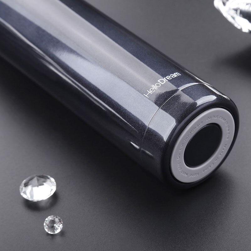 Insulated water bottle with portable handle for travel