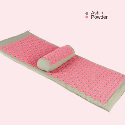 Acupressure mat and pillow set in pink with textured pressure points for massage and relaxation.