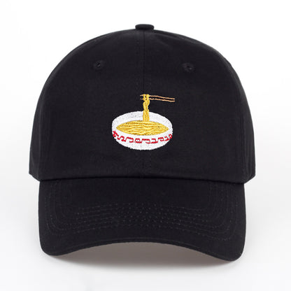 Duckbill baseball cap featuring a unique embroidered ramen bowl design with chopsticks on a black hat.