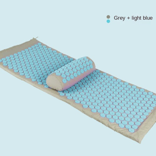 Acupressure mat and pillow set in grey and light blue for massage and yoga relaxation.